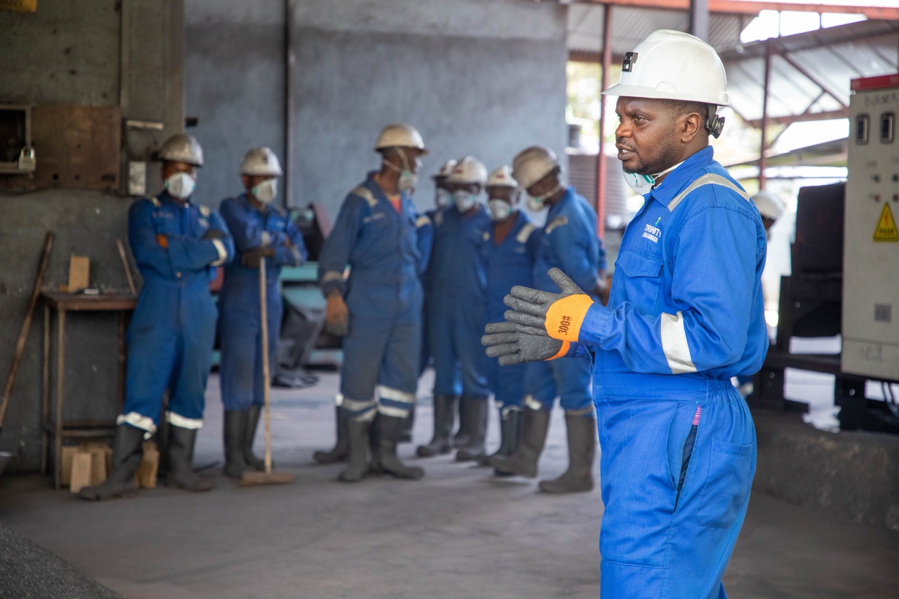 Employees participating in technical training in an industrial facility